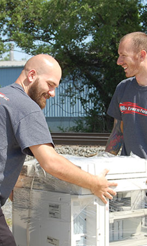 Parcon Express Freight delivery team carefully handling packages in Sinking Spring PA warehouse