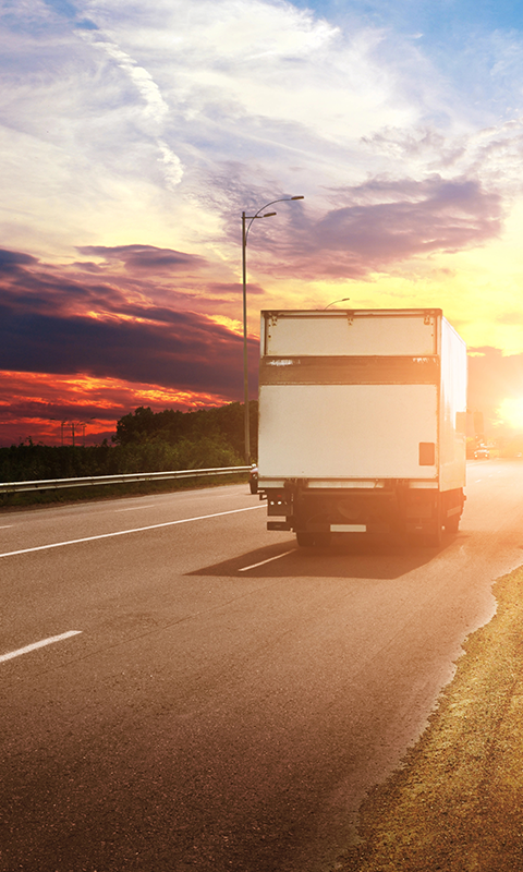 Parcon Express Freight truck providing expedited delivery services across Eastern United States at sunset